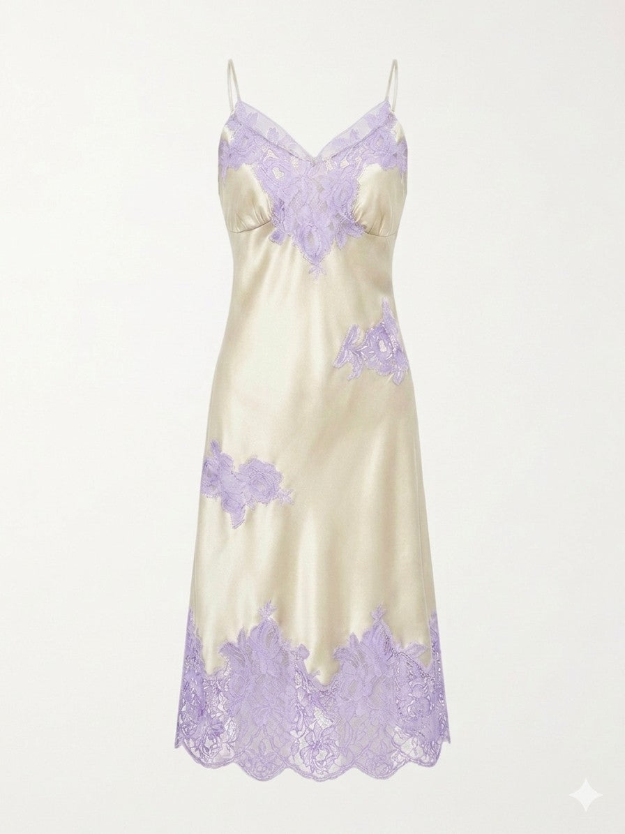 Silk slip dress with lavender lace details on a white background