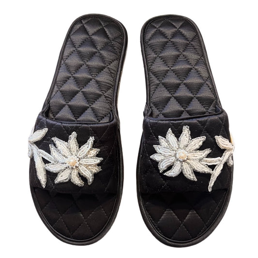 Quilted silk slippers in black and pink with appliqued hand-beaded flowers in white and silver. 