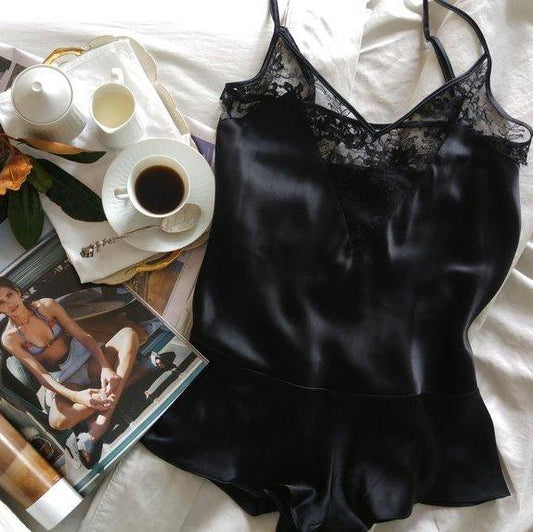 Black Lace Playsuit On Bed With Coffee And Magazines